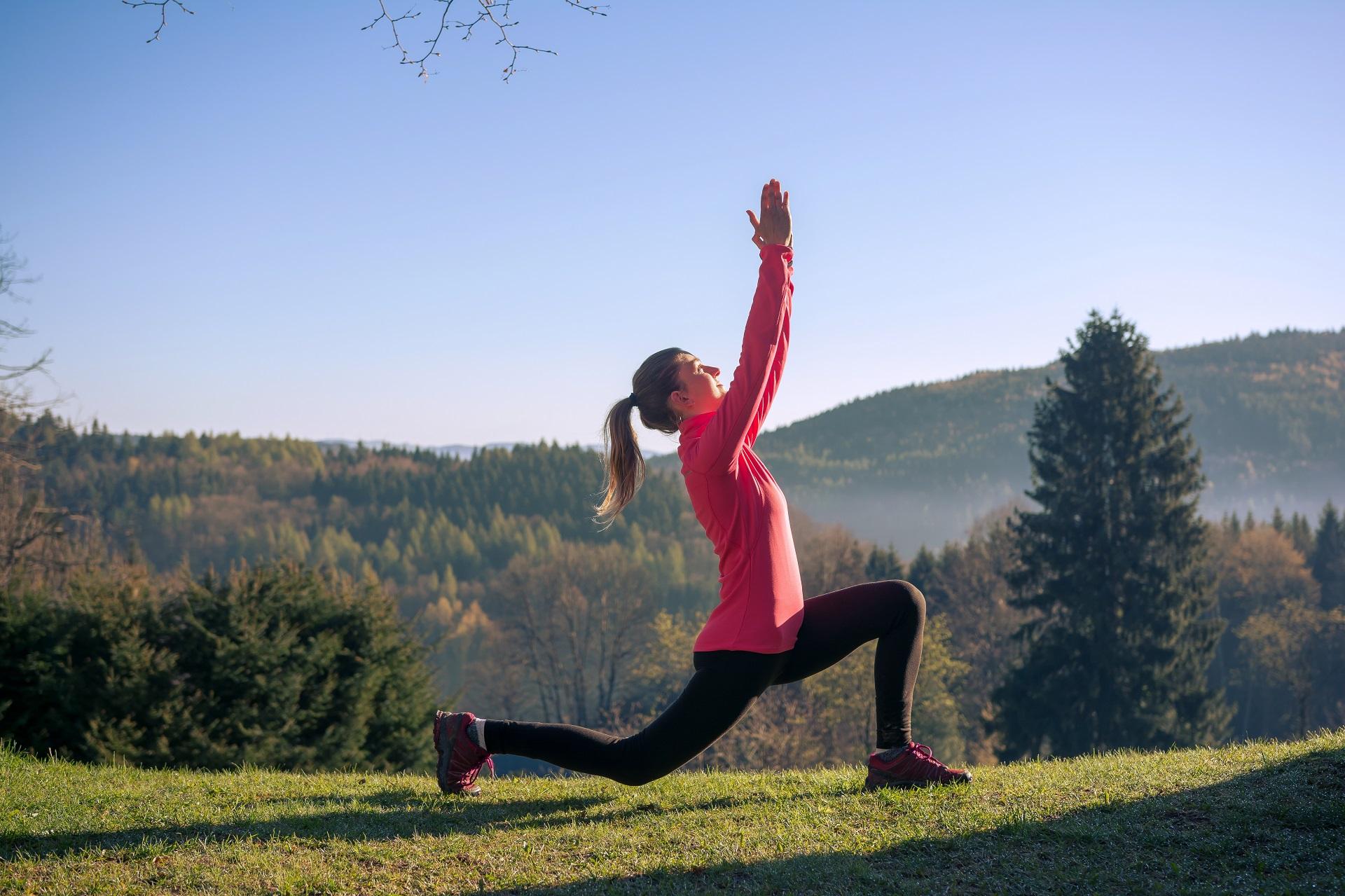 young-fitness-woman-meditating-on-sunrise-mountain-2021-08-29-04-35-23-utc-fhd